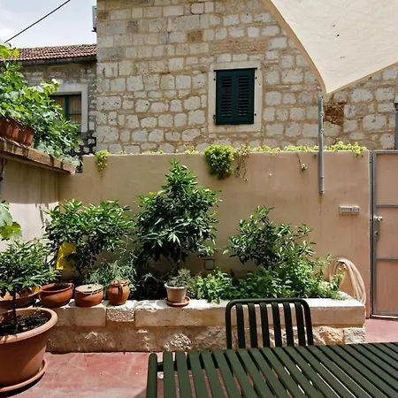 Modern Design In Old Stone House With A Garden In The Center Of Split