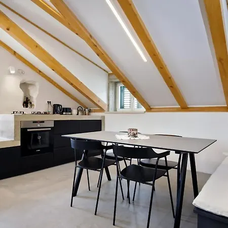 Modern Design In Old Stone House With A Garden In The Center Of