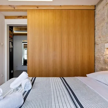 Modern Design In Old Stone House With A Garden In The Center Of