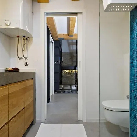 Modern Design In Old Stone House With A Garden In The Center Of