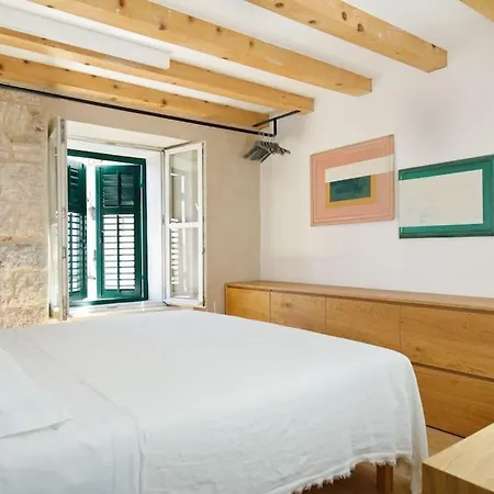 Modern Design In Old Stone House With A Garden In The Center Of Split